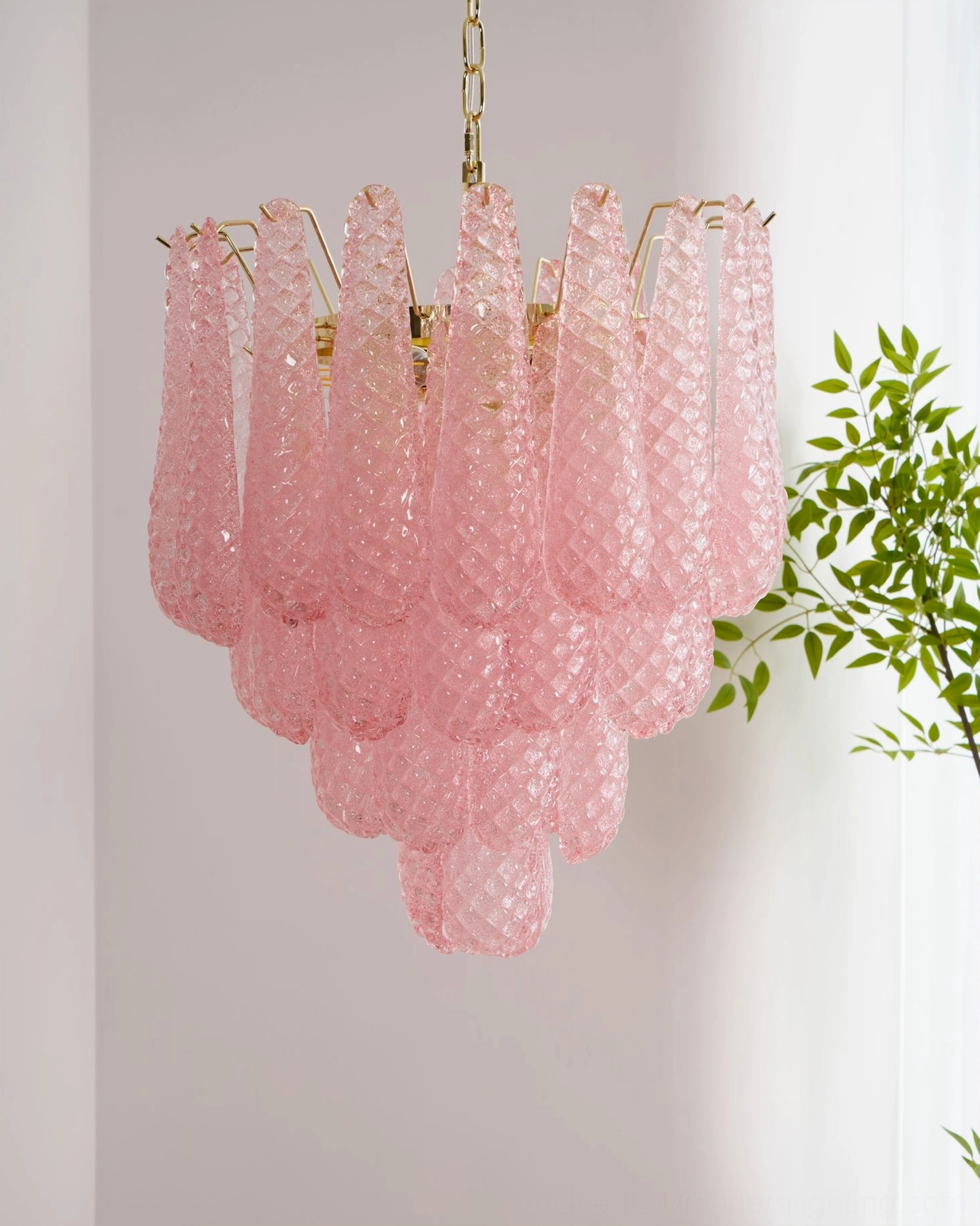 Hand-crafted pink Murano glass chandelier in neutral interior setting with warm tones