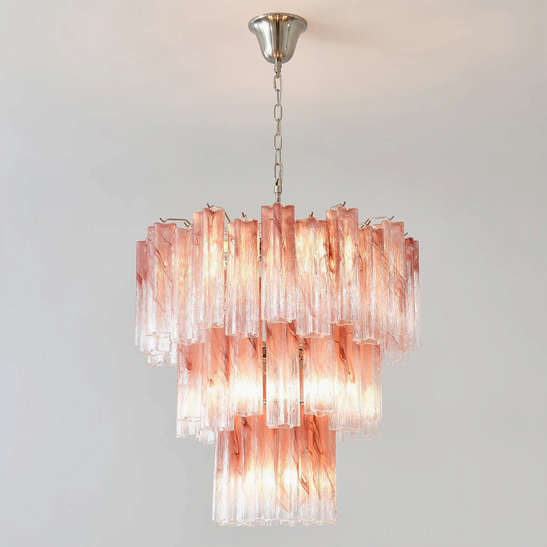 Front eye-level perspective of handcrafted pink Murano glass tube chandelier with warm gradient illumination