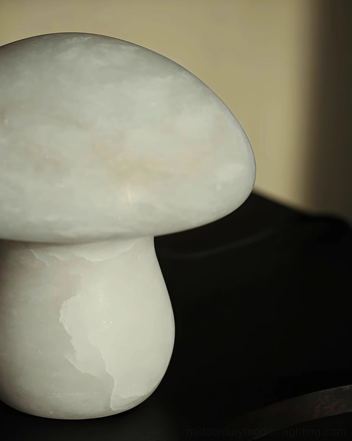 Close-up extreme detail of mushroom alabaster lamp showing natural stone texture and solid material craftsmanship