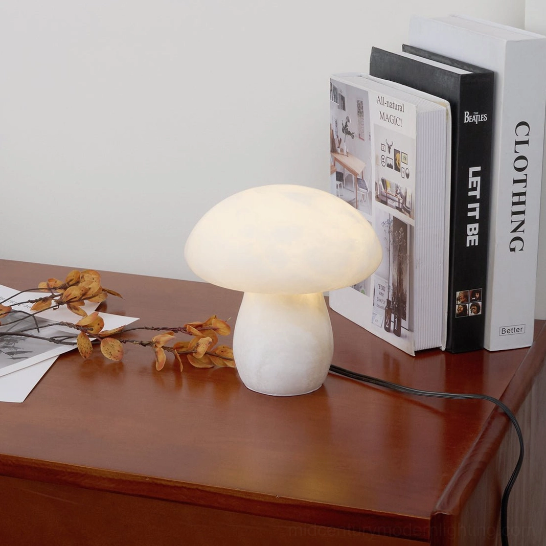 Mushroom alabaster table lamp illuminated with warm glowing light creating sophisticated ambient decor in modern interior