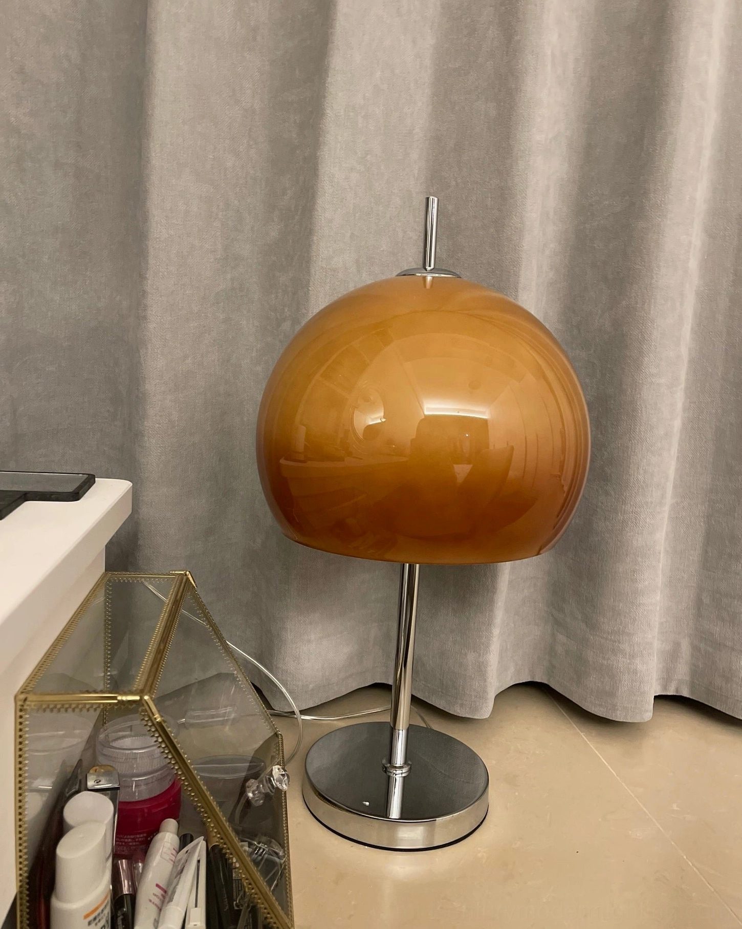 Retro mushroom table lamp creating warm ambient glow in bedroom reading nook setting