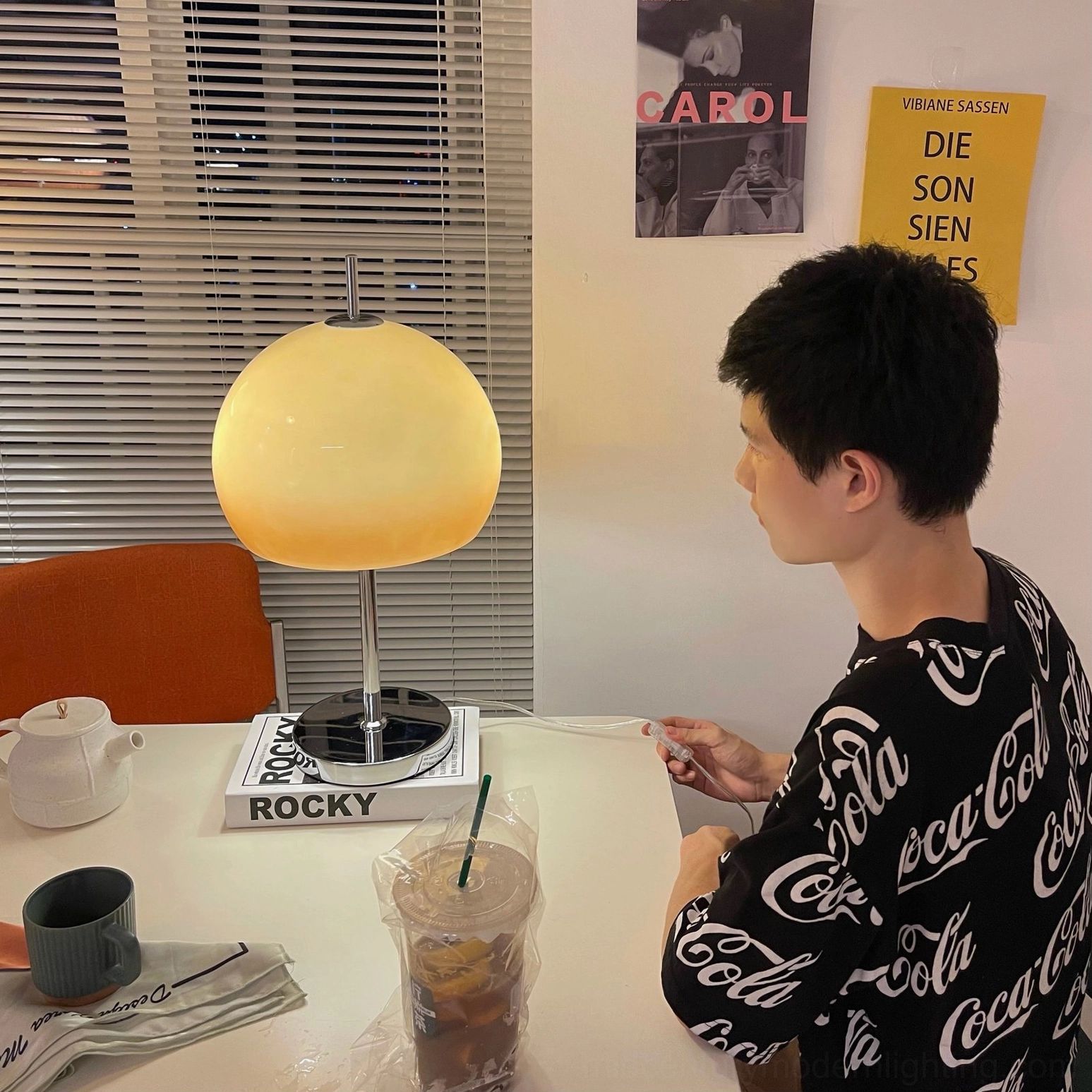 Mid-century modern mushroom lamp with warm glow in cozy living room corner arrangement
