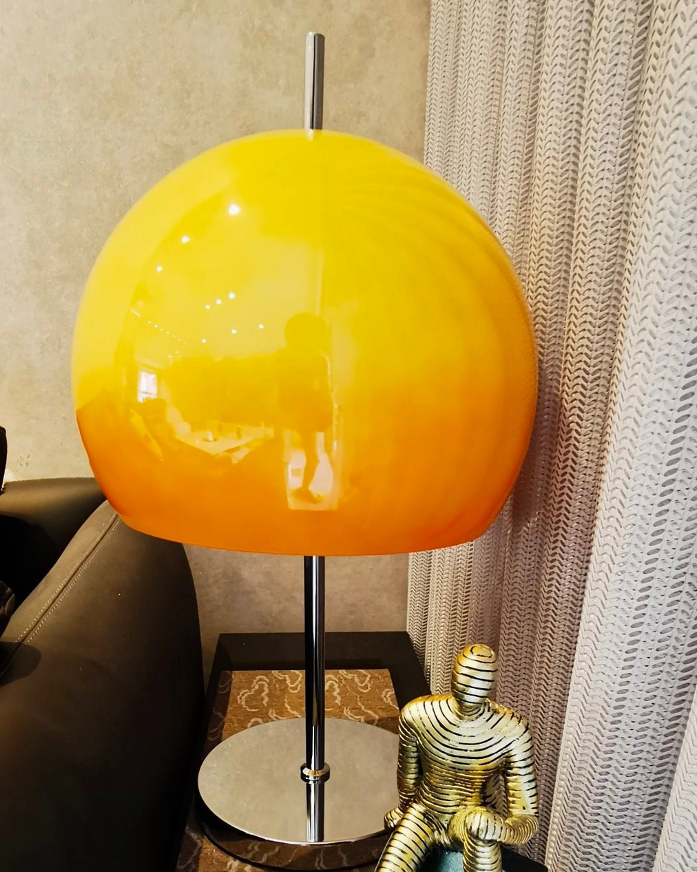 Retro mushroom lamp with dome shade and metal base in eclectic home interior arrangement