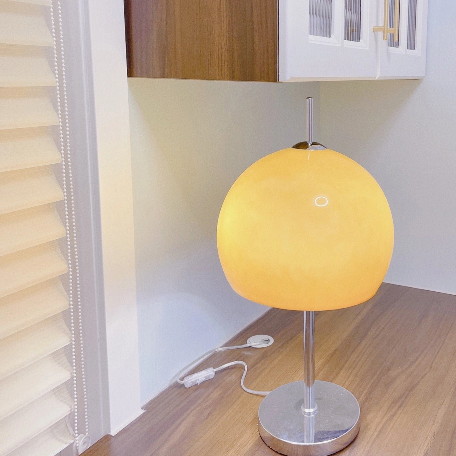 Mushroom lamp with warm amber dome shade in minimalist hallway entry way lighting