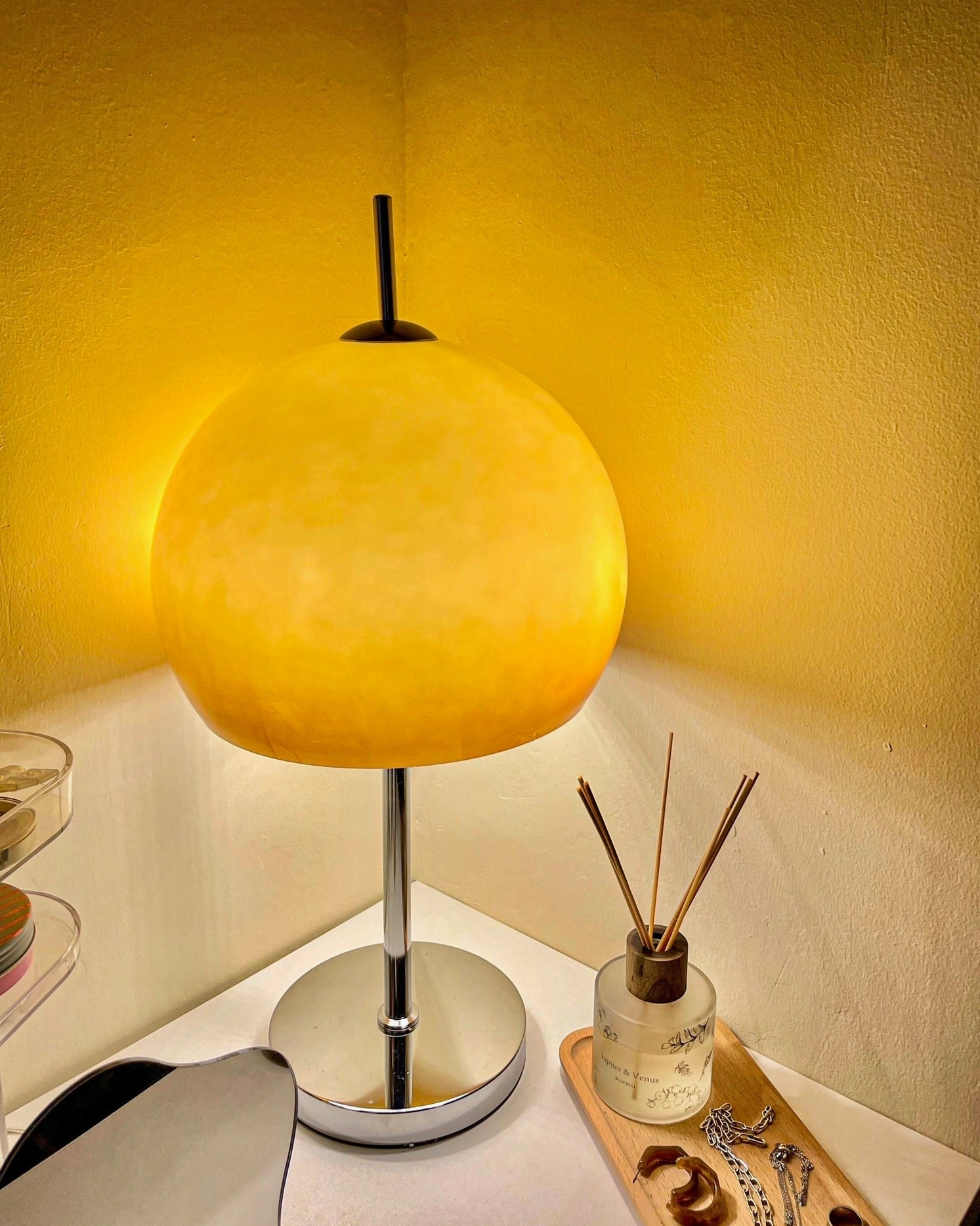 Mushroom table lamp with dome shade providing task lighting on home office desk workspace