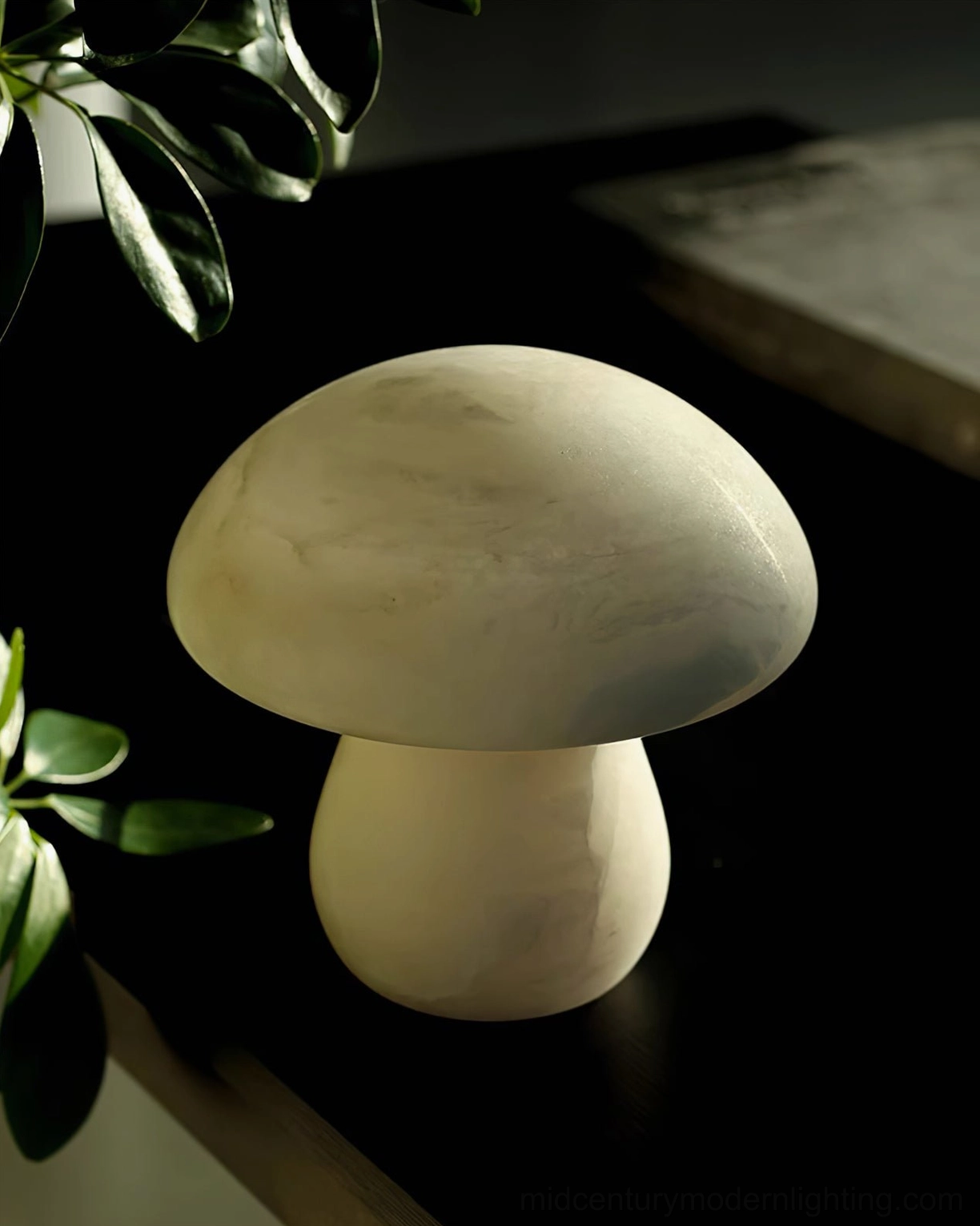 Mushroom alabaster table lamp with subtle natural marble veins in dimly lit interior setting with muted beige-white hue