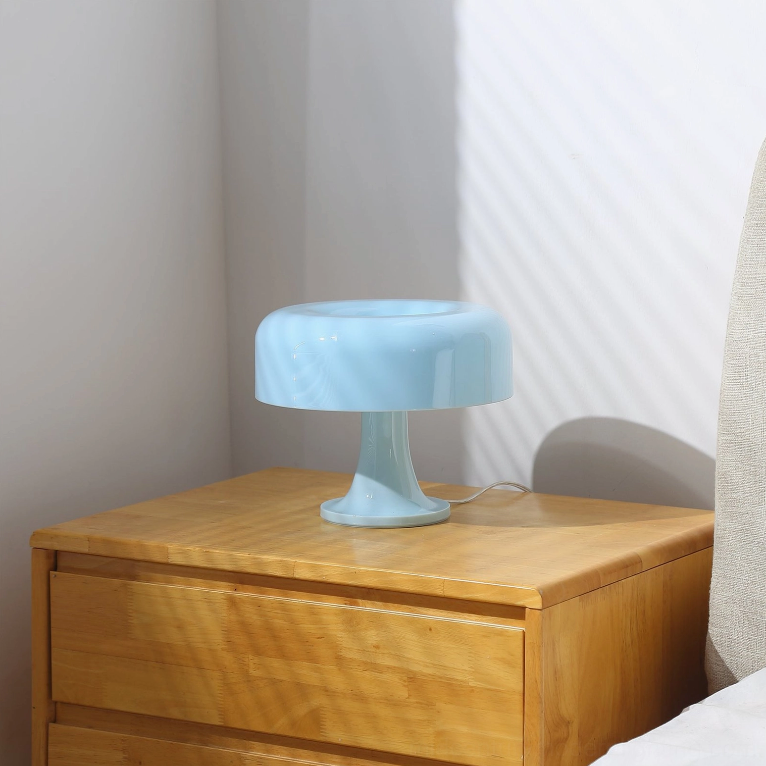 Mushroom table lamp with recessed cap detail showing light reflection through translucent acrylic dome