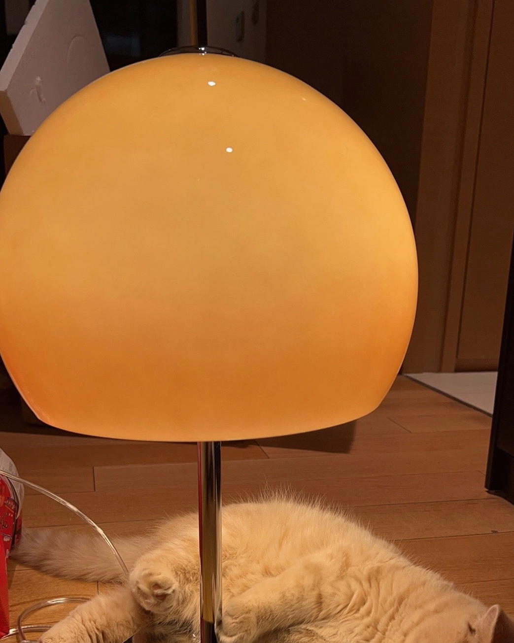 Mid-century modern mushroom lamp in minimalist Scandinavian interior with natural wood furniture