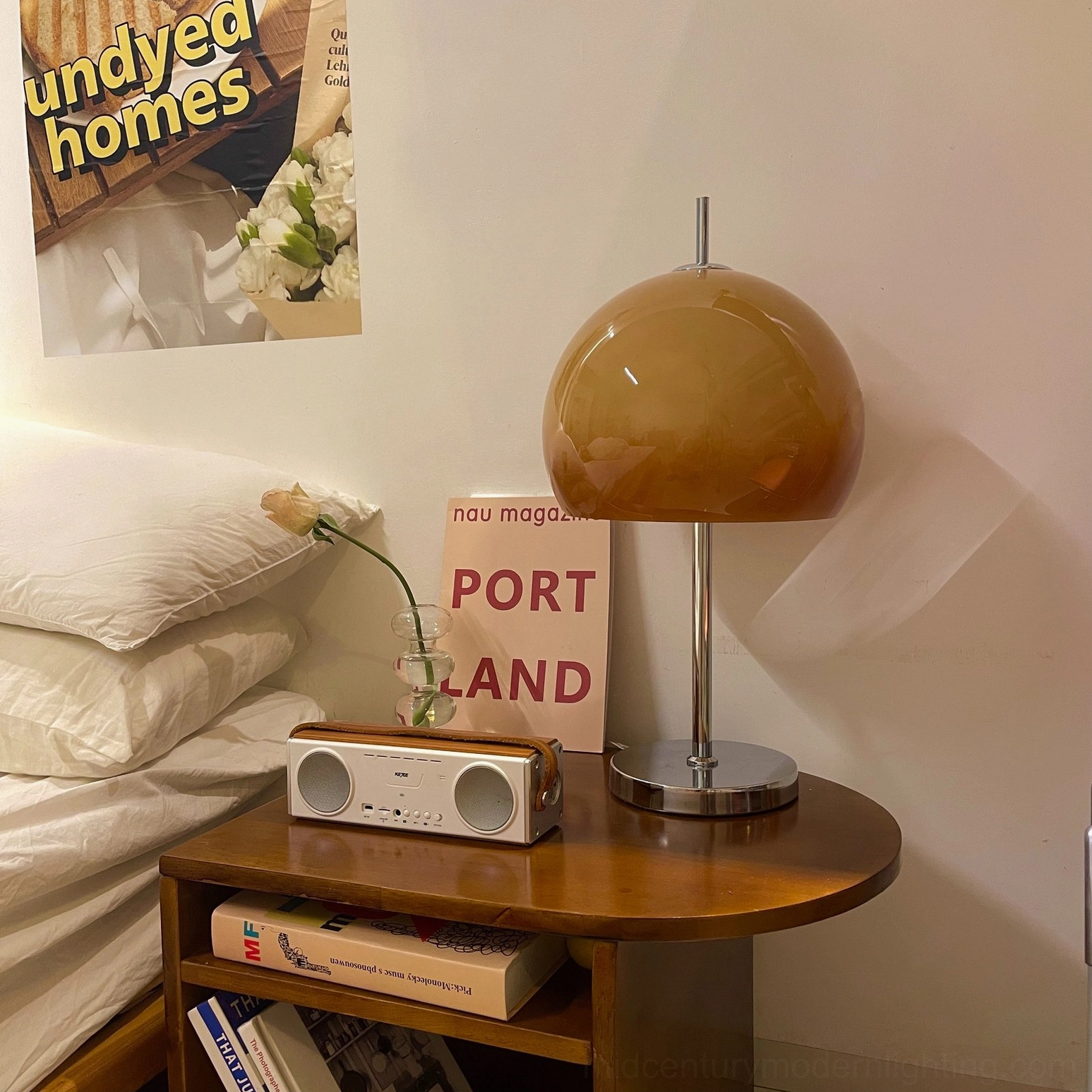 Three-quarter view of mushroom table lamp showing brown gradient acrylic shade and chrome stand in vintage room setting