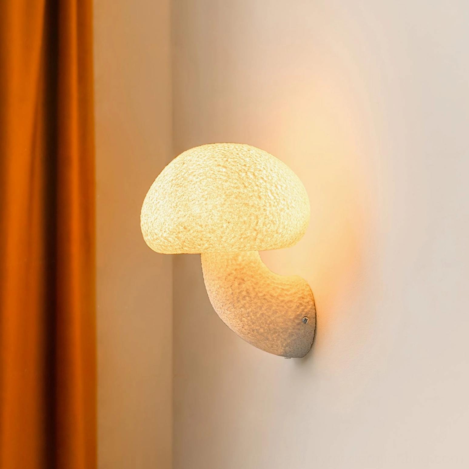 Illuminated mushroom resin wall lamp close-up - warm glow showing matte textured surface detail