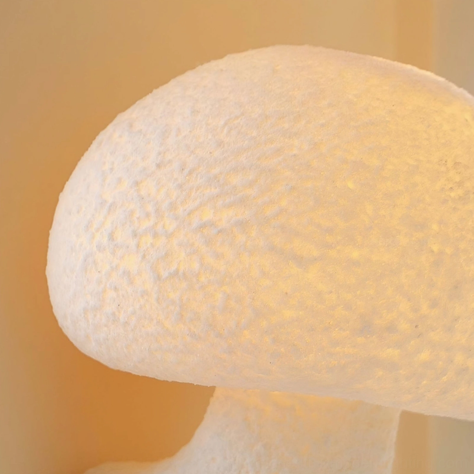 Mushroom resin wall lamp installed in living space - organic modern ambient lighting effect