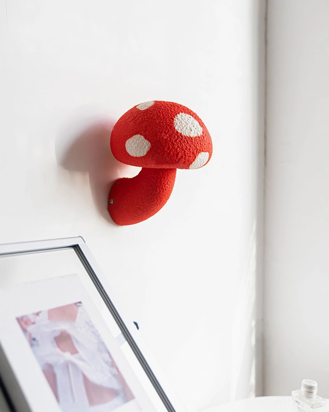 Mushroom resin wall lamp installation view - wall-mounted organic form lighting fixture