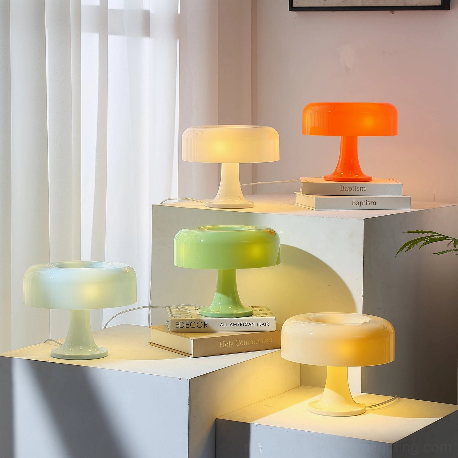 Four pastel mushroom table lamps displayed on indoor platform with warm ambient lighting, mid-century modern design showcase