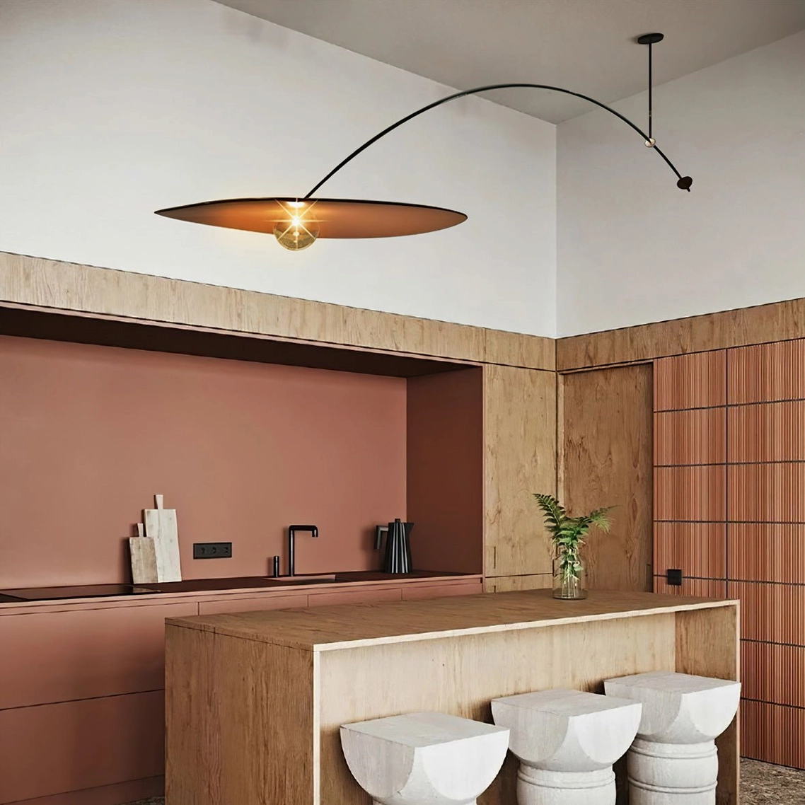 Myrna wide arc kitchen pendant light above wooden island, modern luxury kitchen lighting solution