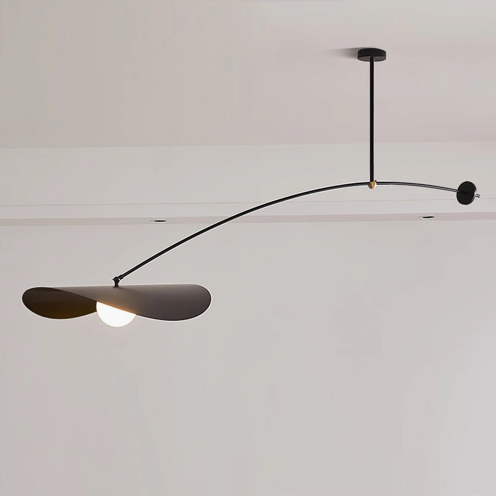 Black Myrna ceiling pendant with long articulating arm and sliding counterweight mechanism, overhead studio perspective