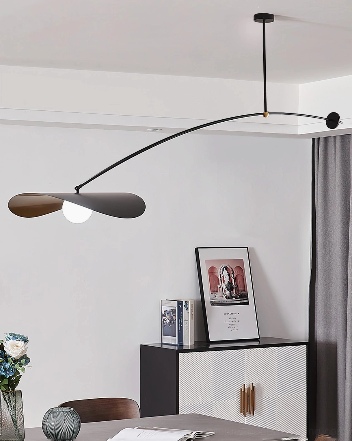 Myrna adjustable ceiling pendant in contemporary dining room with sideboard and artwork, Scandinavian minimalist design