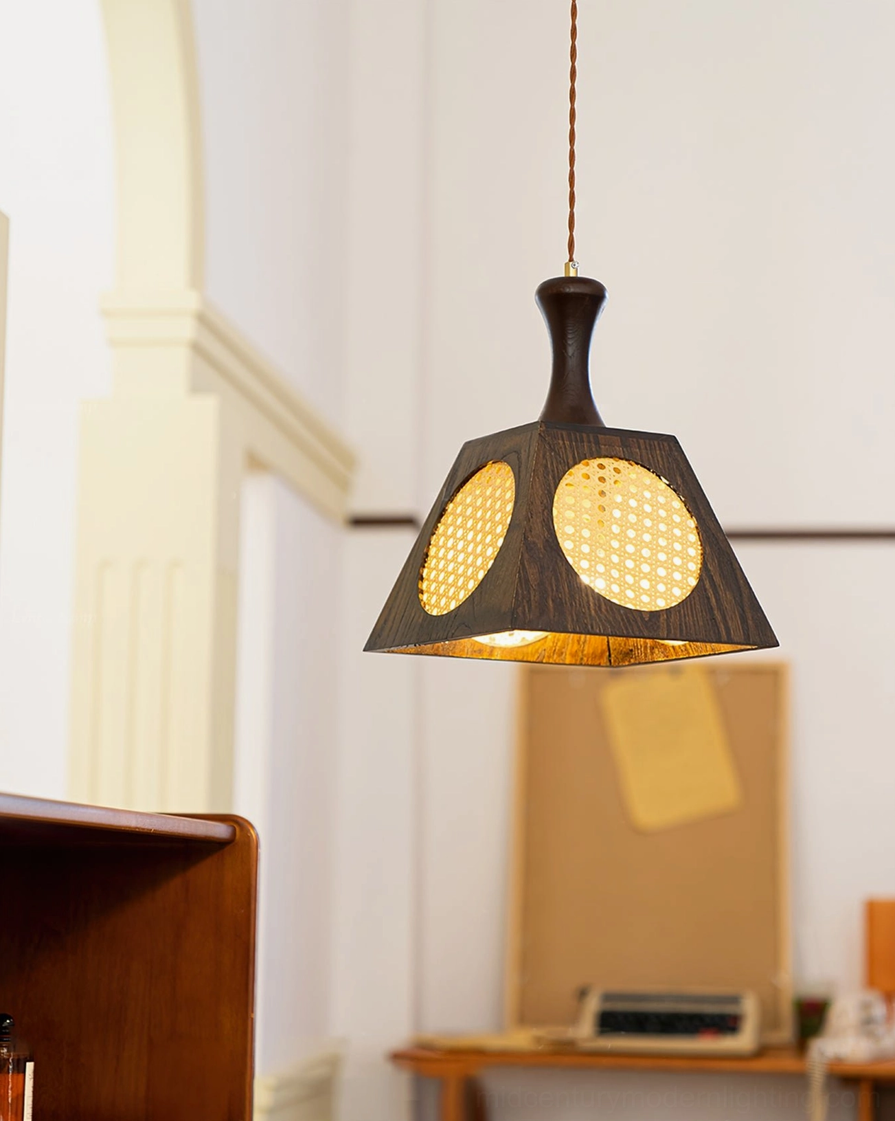Mysore lamp with dual rattan inlays installed in vintage home office with desk, low-angle front view showing warm interior lighting