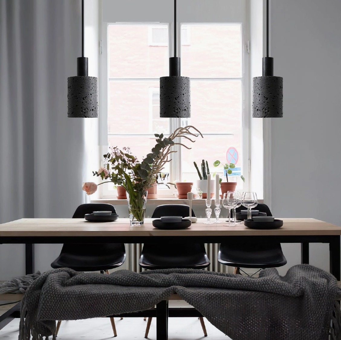 Three N Stone Pendant Lamps suspended in modern Nordic dining room with neutral minimalist interior design