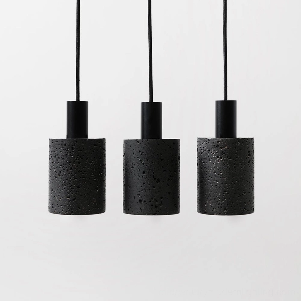Four parallel N Stone Pendant Lamps arranged in uniform row showcasing cylindrical minimalist design