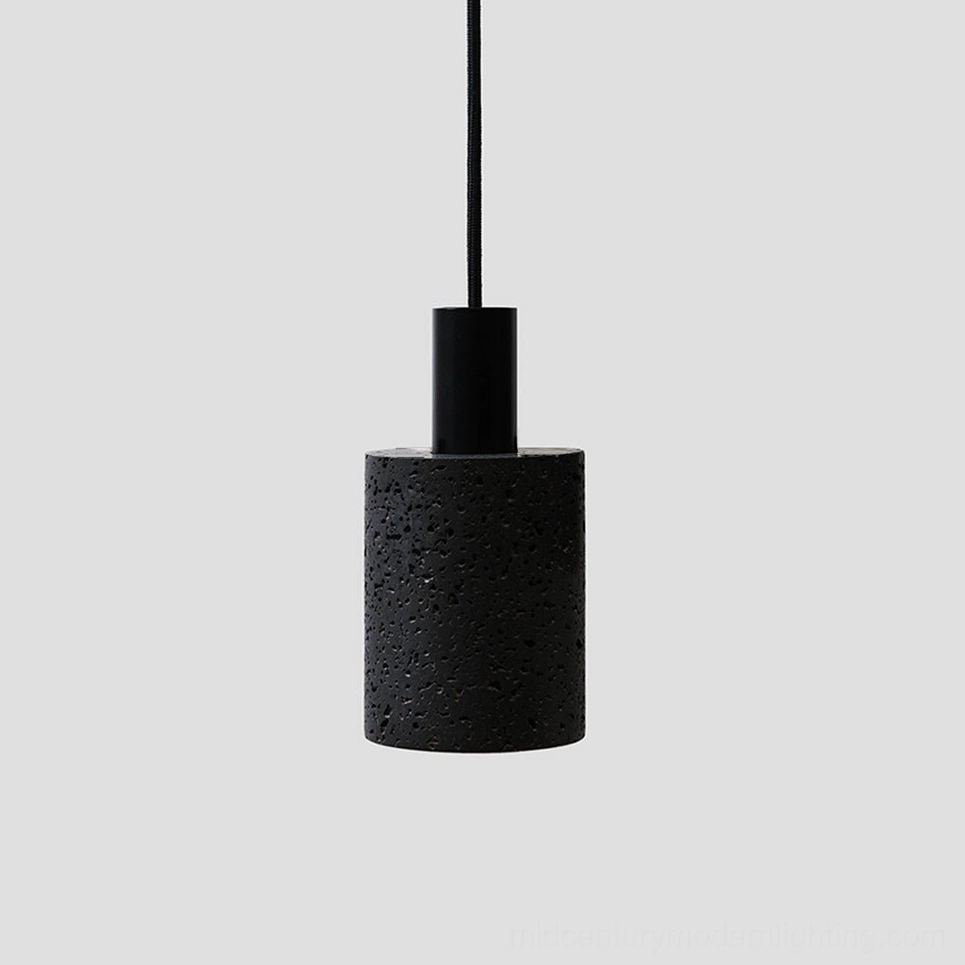 Single N Stone Pendant Lamp in matte black with porous volcanic stone surface and brushed metal fixture