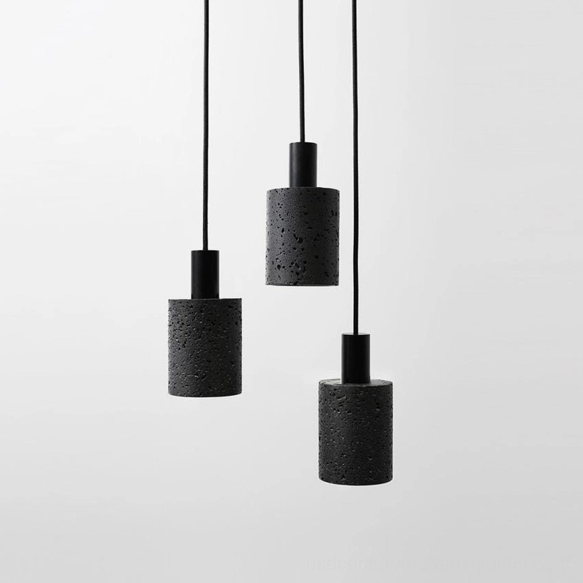 Asymmetrical arrangement of four N Stone Pendant Lamps at varied hanging heights creating dynamic composition