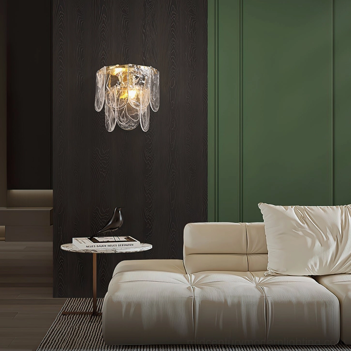 Nason brass wall sconce flanking modern living room with tufted sofa, dark wood and green wall panels