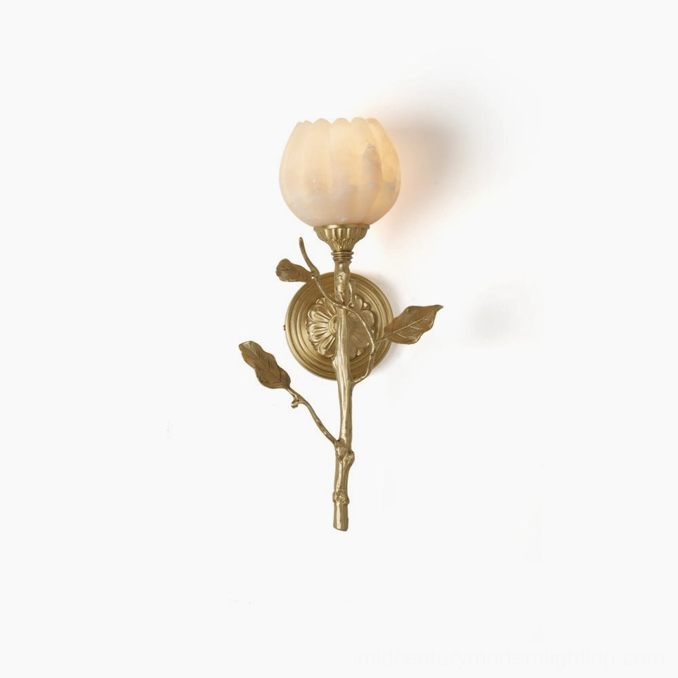 Natalia hand-carved alabaster wall sconce with tulip-shaped shade and brass branch detailing in front overhead studio view