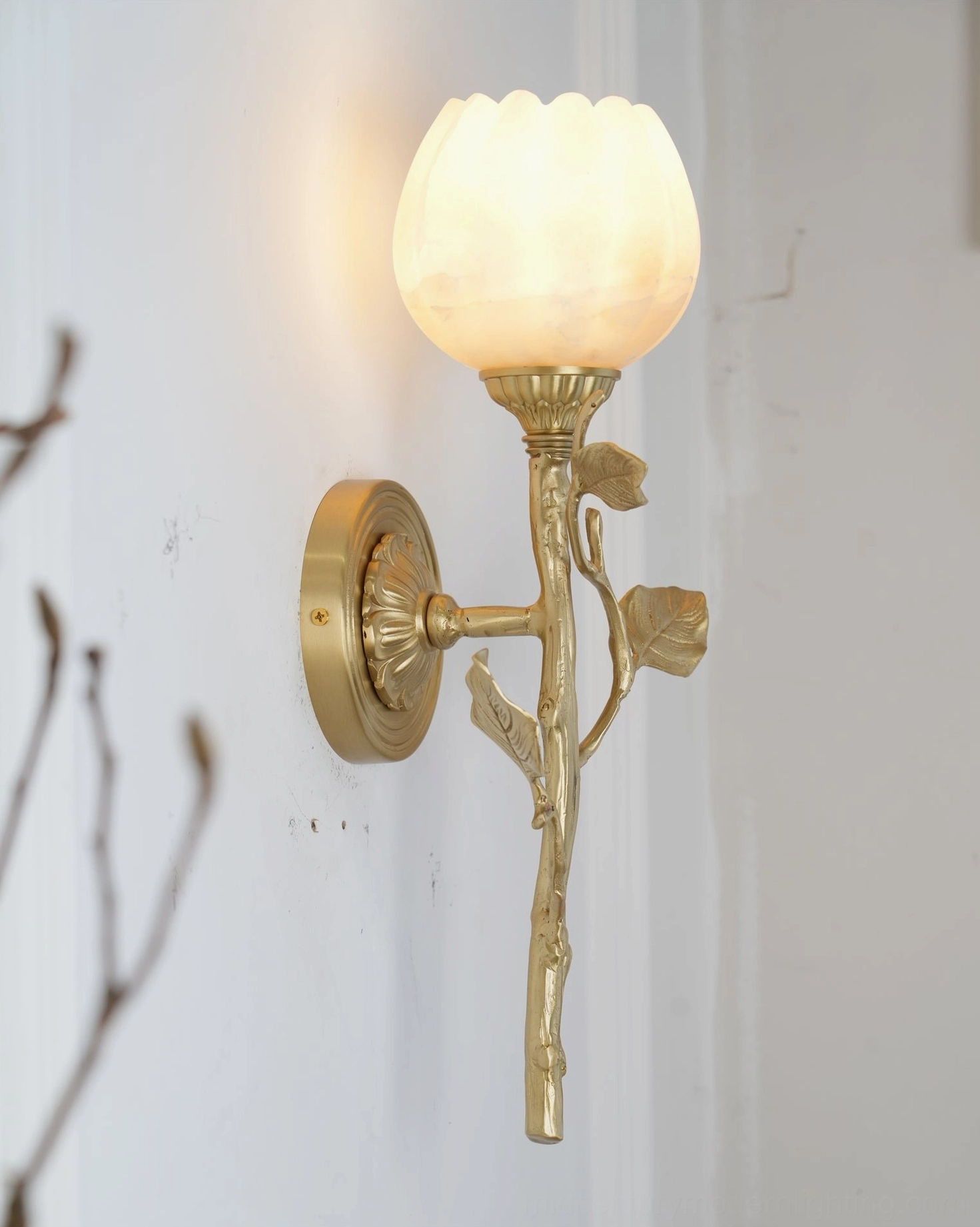 Natalia alabaster wall sconce ambient lighting effect showcasing warm glow and organic design elegance