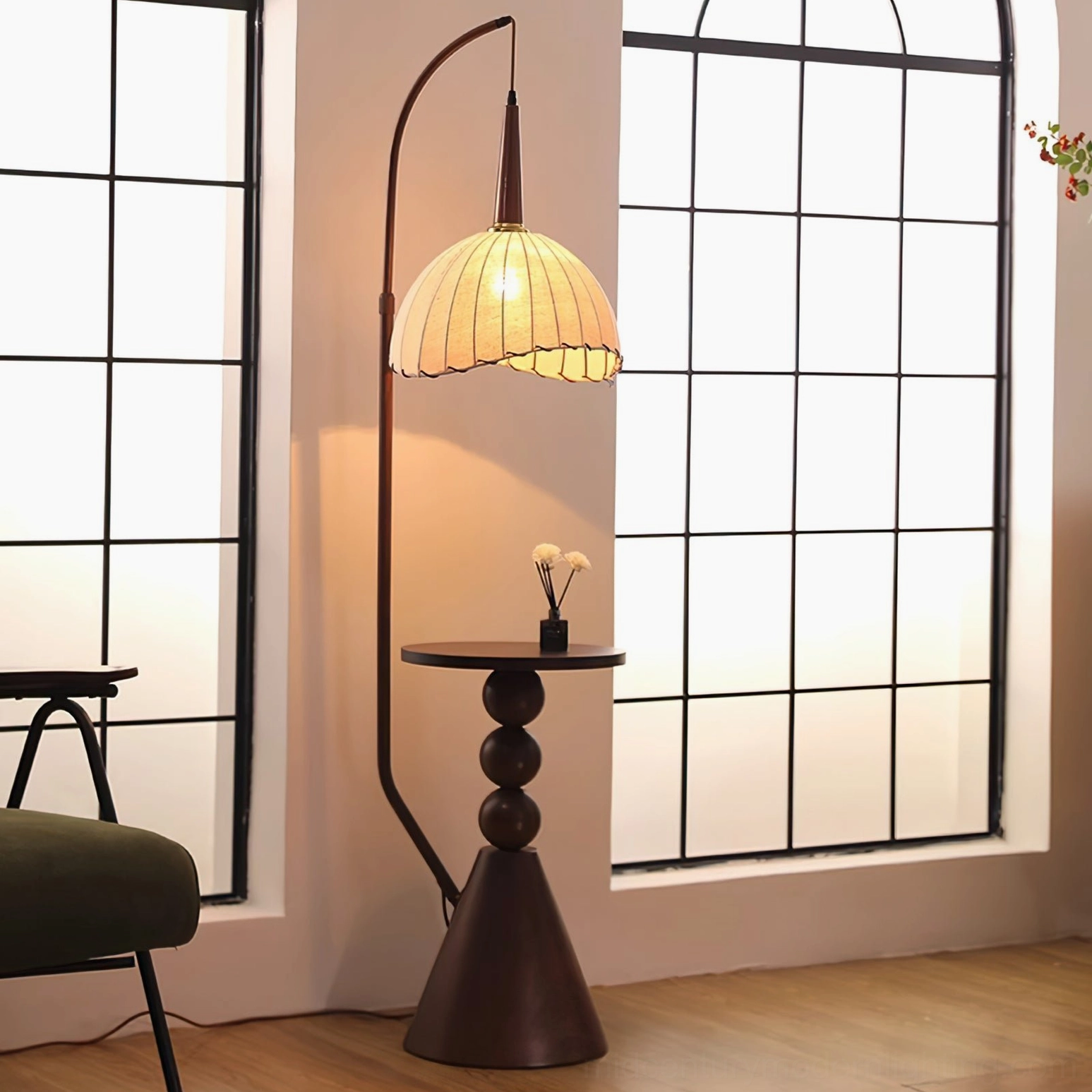 Naumy arc floor lamp with warm beige fabric shade and turned wooden table base, living room with black grid window backdrop