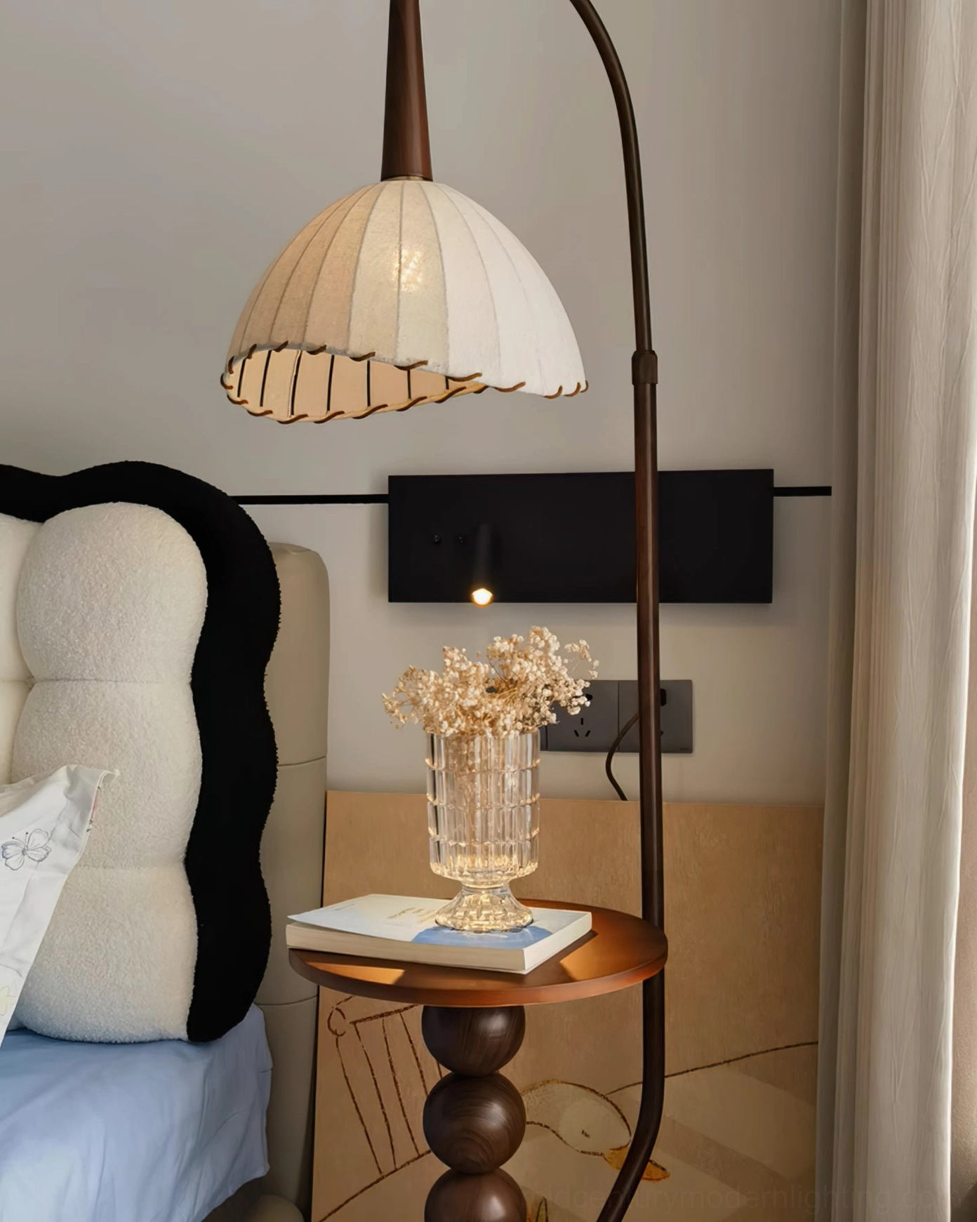Naumy lamp side table detail with off-white pleated shade in modern vintage bedroom setting with decorative accessories