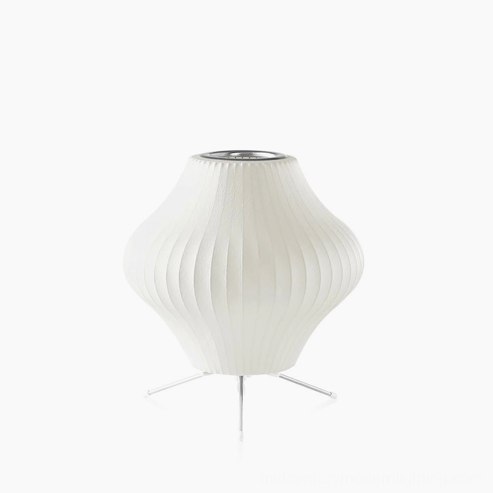 George Nelson bubble tripod table lamp with pear-shaped ribbed shade and silver metal tripod base on pure white studio background