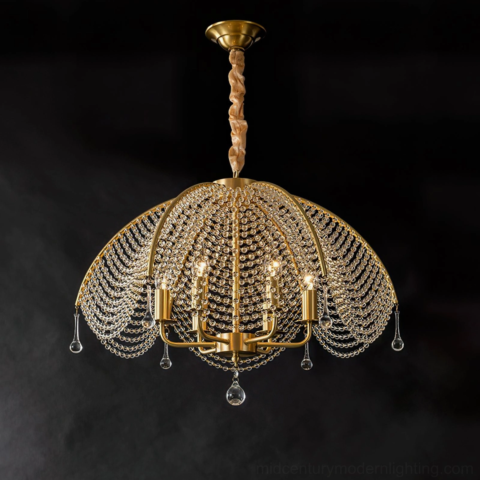 Neville crystal brass chandelier angled perspective view highlighting scalloped design against dark gray backdrop