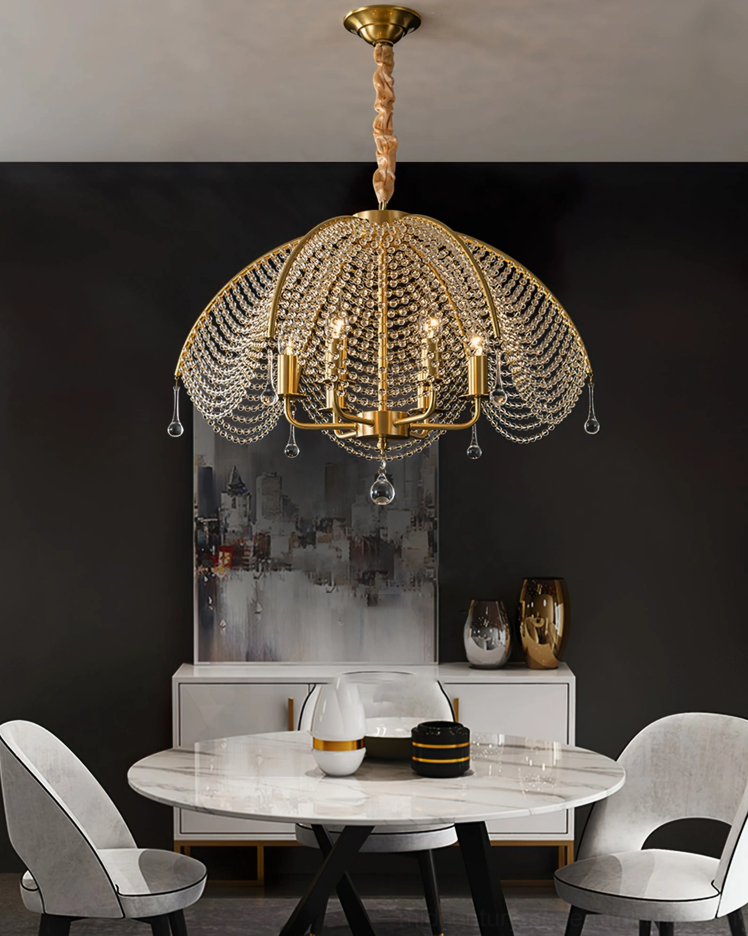 Neville brass crystal chandelier positioned above dining table in dark luxury dining room setting