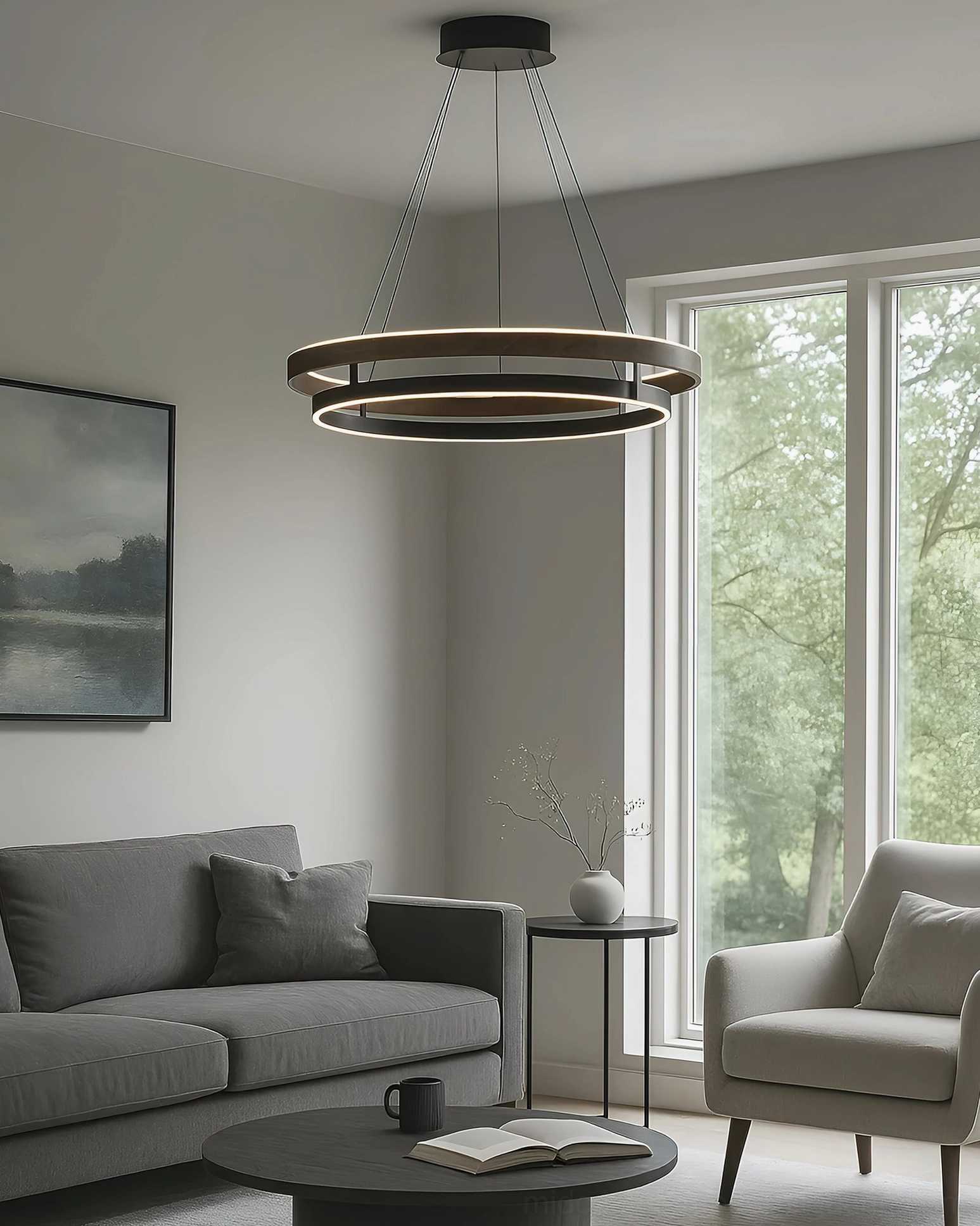 Niseko modern pendant creating cozy ambient lighting in minimalist living room with gray sofa