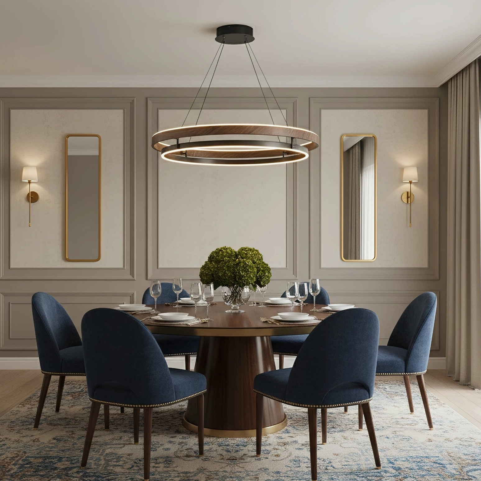Niseko modern pendant fixture illuminating minimalist dining space with navy blue velvet chairs