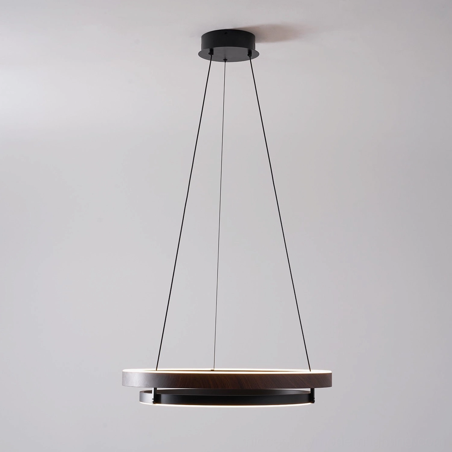 Niseko double-ring pendant light installed in open-plan loft space with concrete ceiling