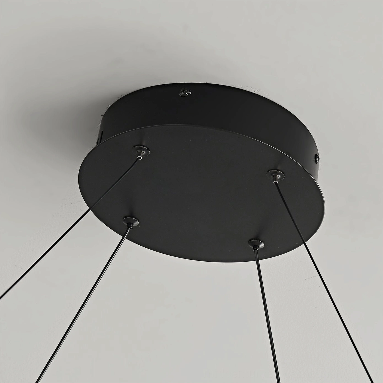 Niseko double-ring pendant light showing walnut paper finish and matte black metal trim construction