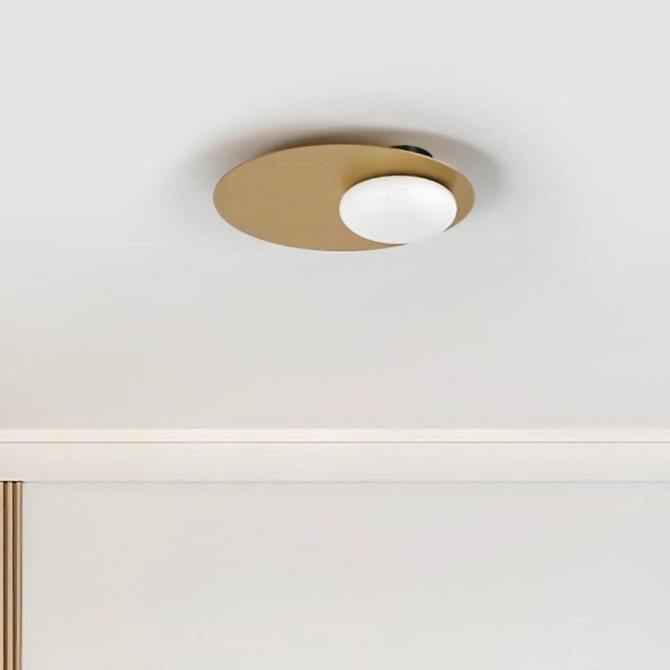 Nodes flush ceiling lamp compact round brass base with spherical frosted white glass viewed from below