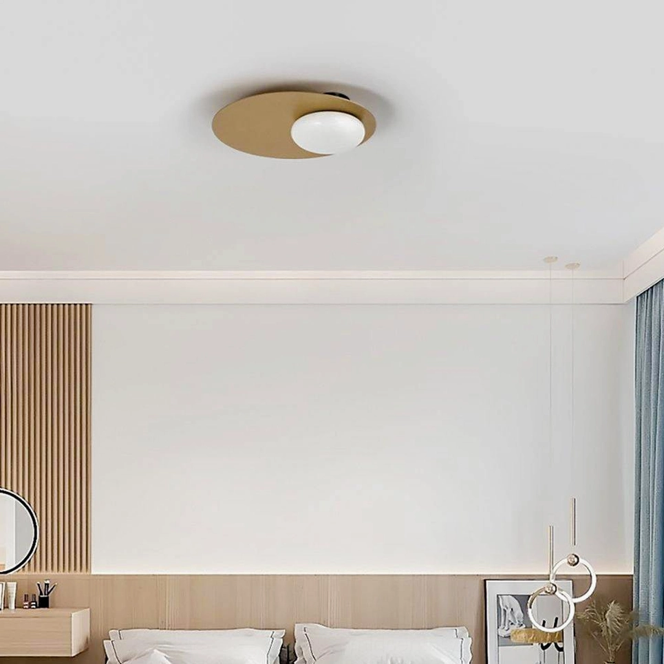 Nodes ceiling lamp installed in modern bedroom setting with wood paneling and minimalist decor