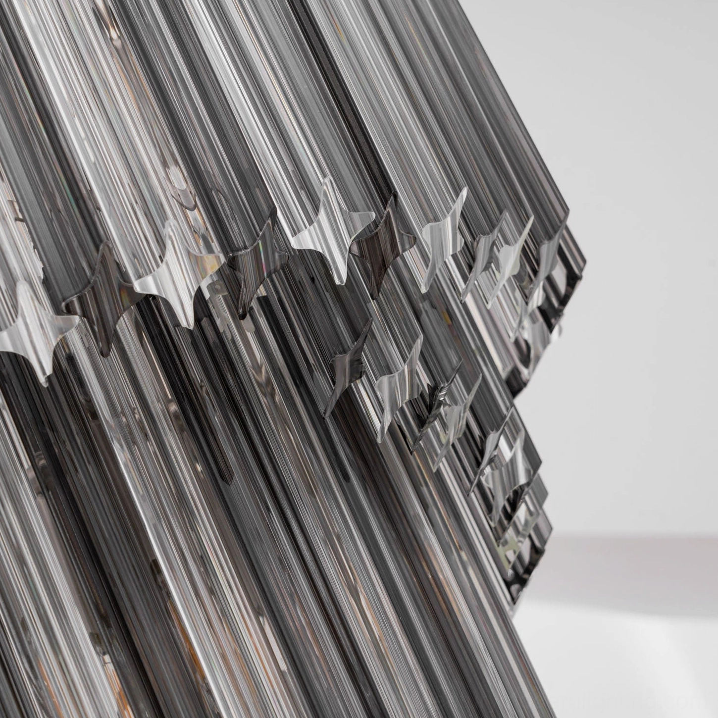 Noir spiral chandelier architectural detail showing precision-cut glass layers and suspension mechanism