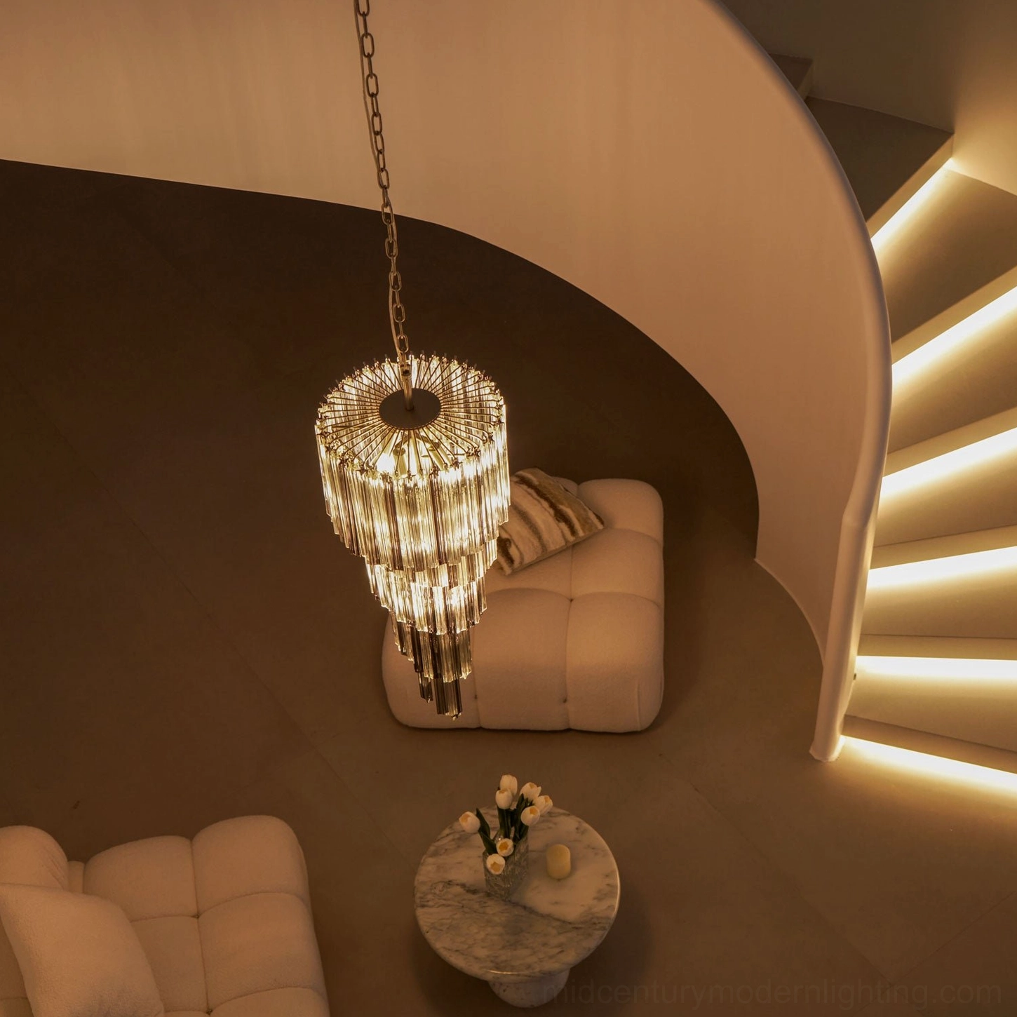 Noir chandelier glass detail showing precision-cut smoke gray tiers and light refraction properties
