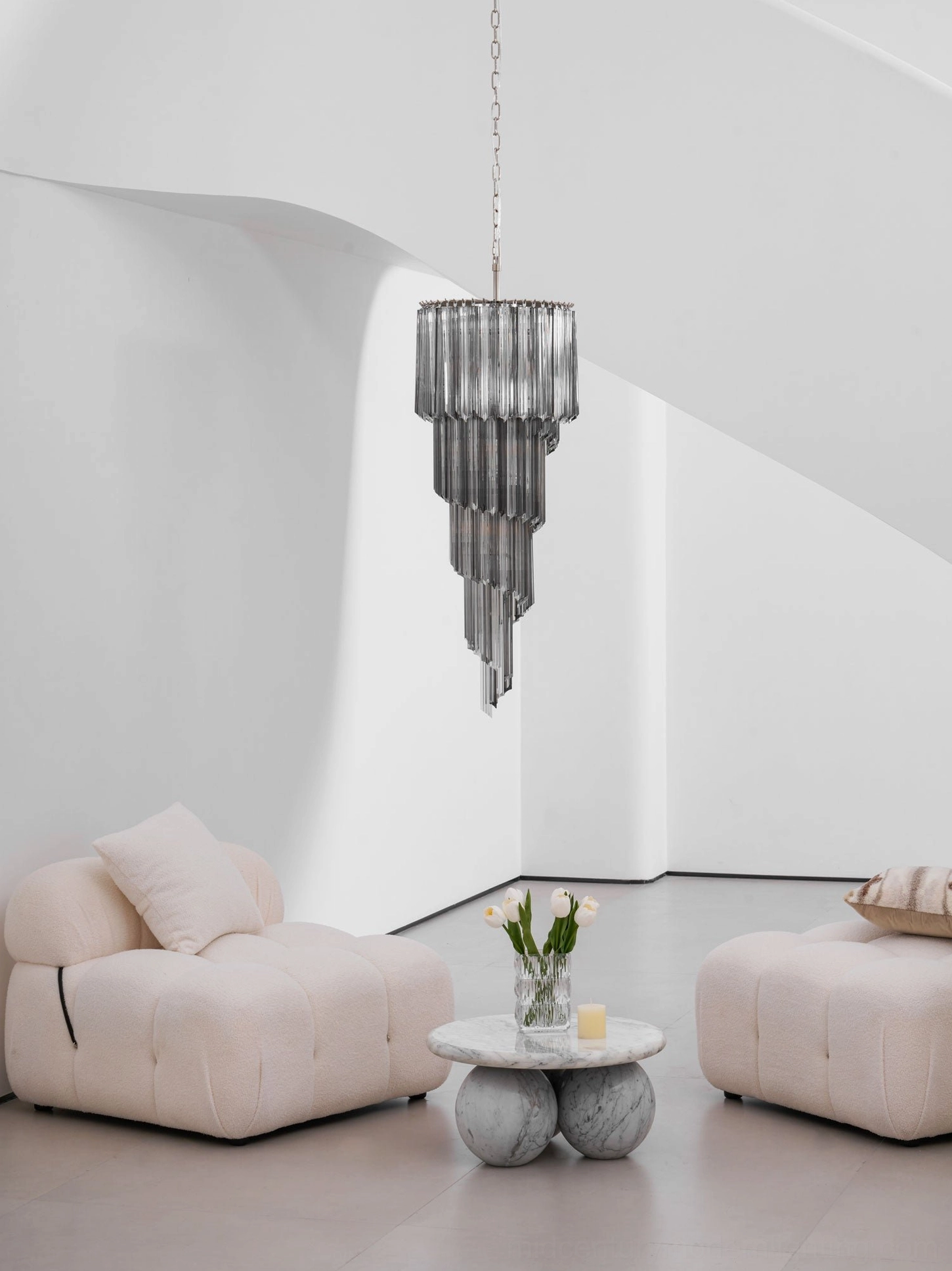 Spiral smoked glass chandelier in upscale residential interior, luxury lighting fixture demonstration
