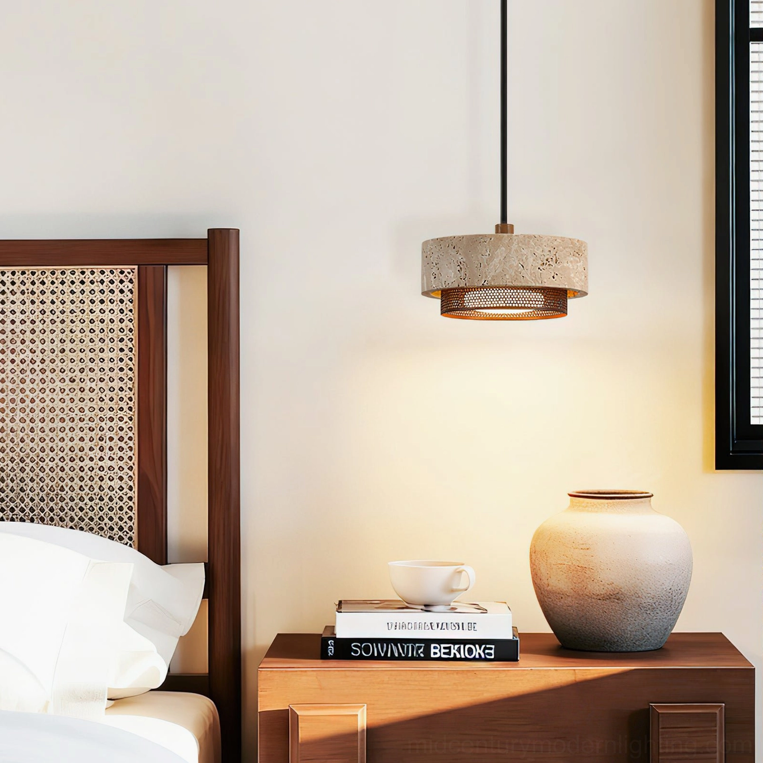 Nolan travertine pendant light suspended above rattan wooden bed frame, complementing woven natural materials and organic bedroom aesthetic