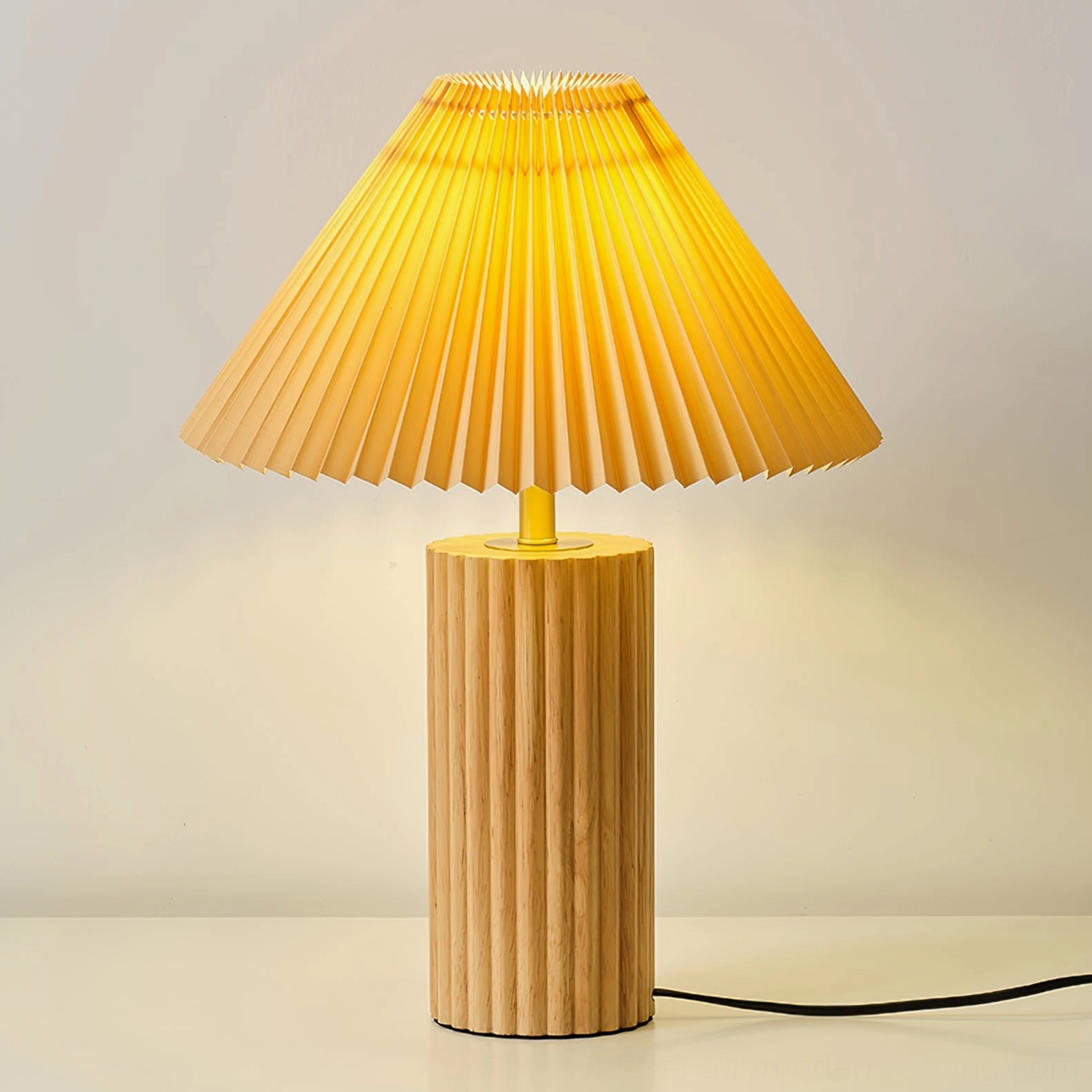 Nora table lamp close-up front view showing pleated fabric texture and power cord detail