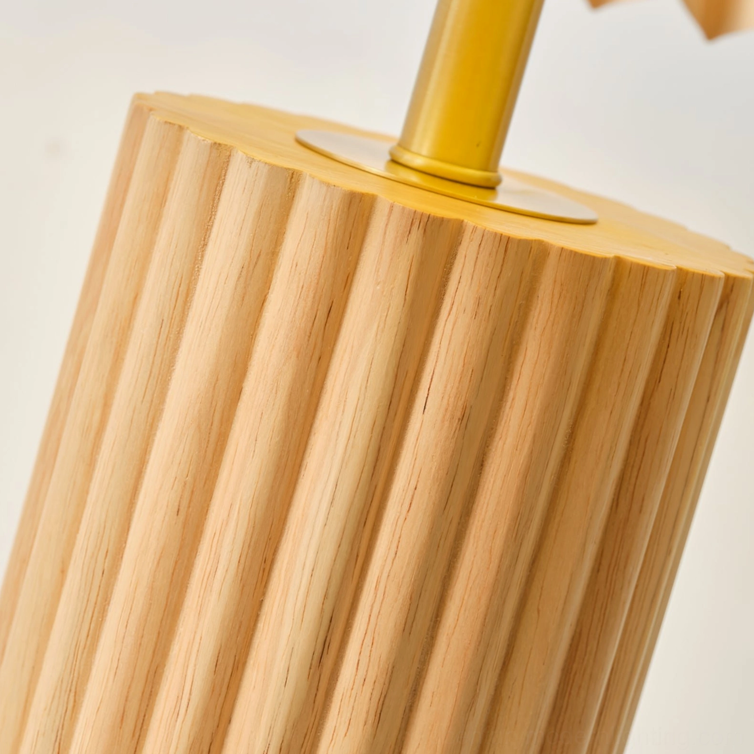 Nora table lamp wooden base close-up showing fluted cylindrical design and brass joint connector