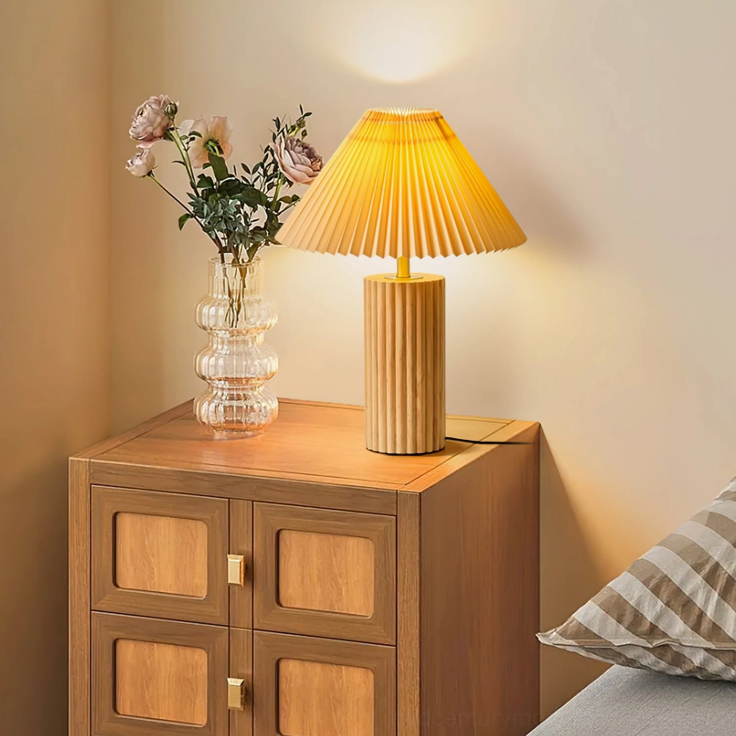 Nora lamp on bedroom side table with glass flower vase and minimalist bedside styling