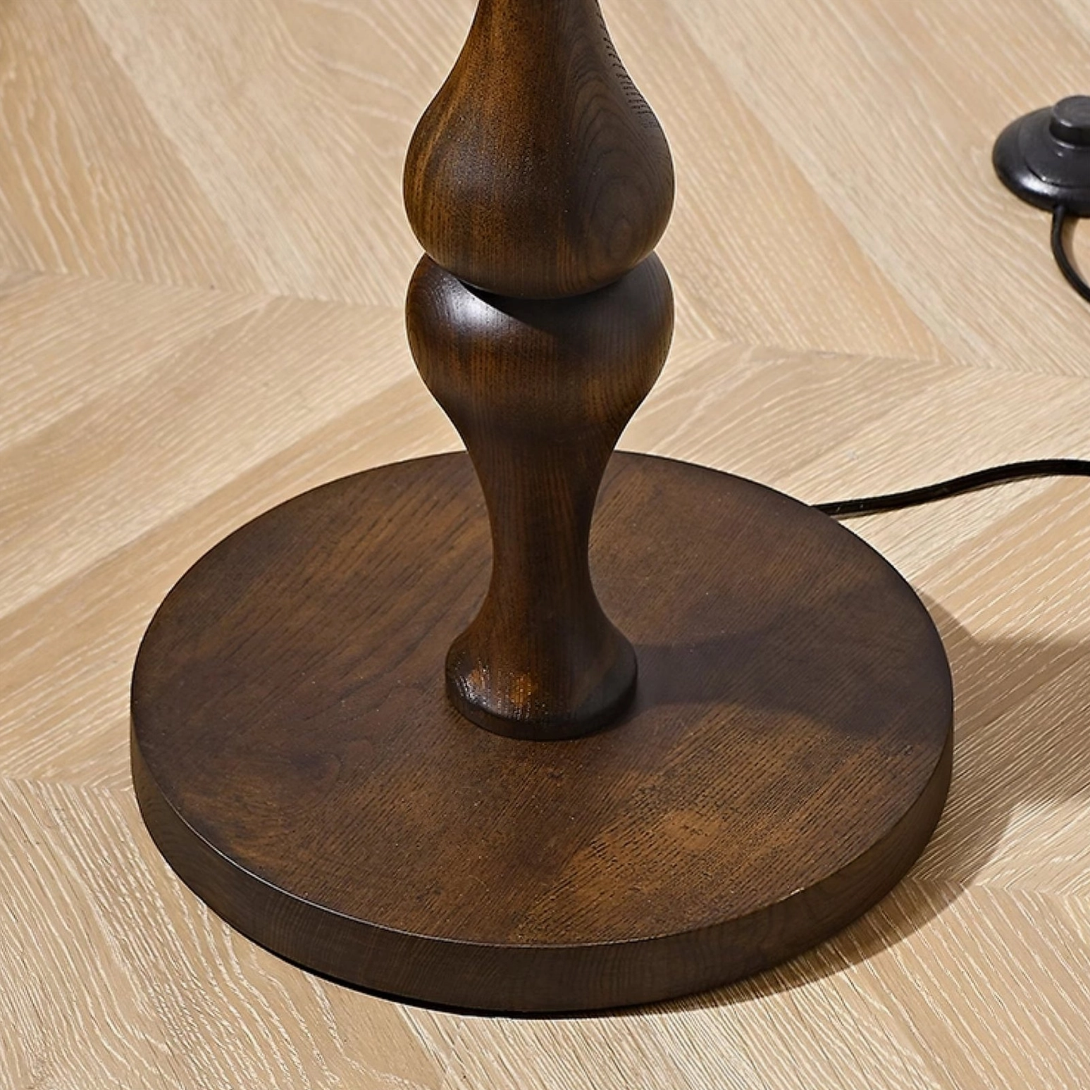 Norden wooden carved pole floor lamp detail shot, showcasing intricate wood grain and texture