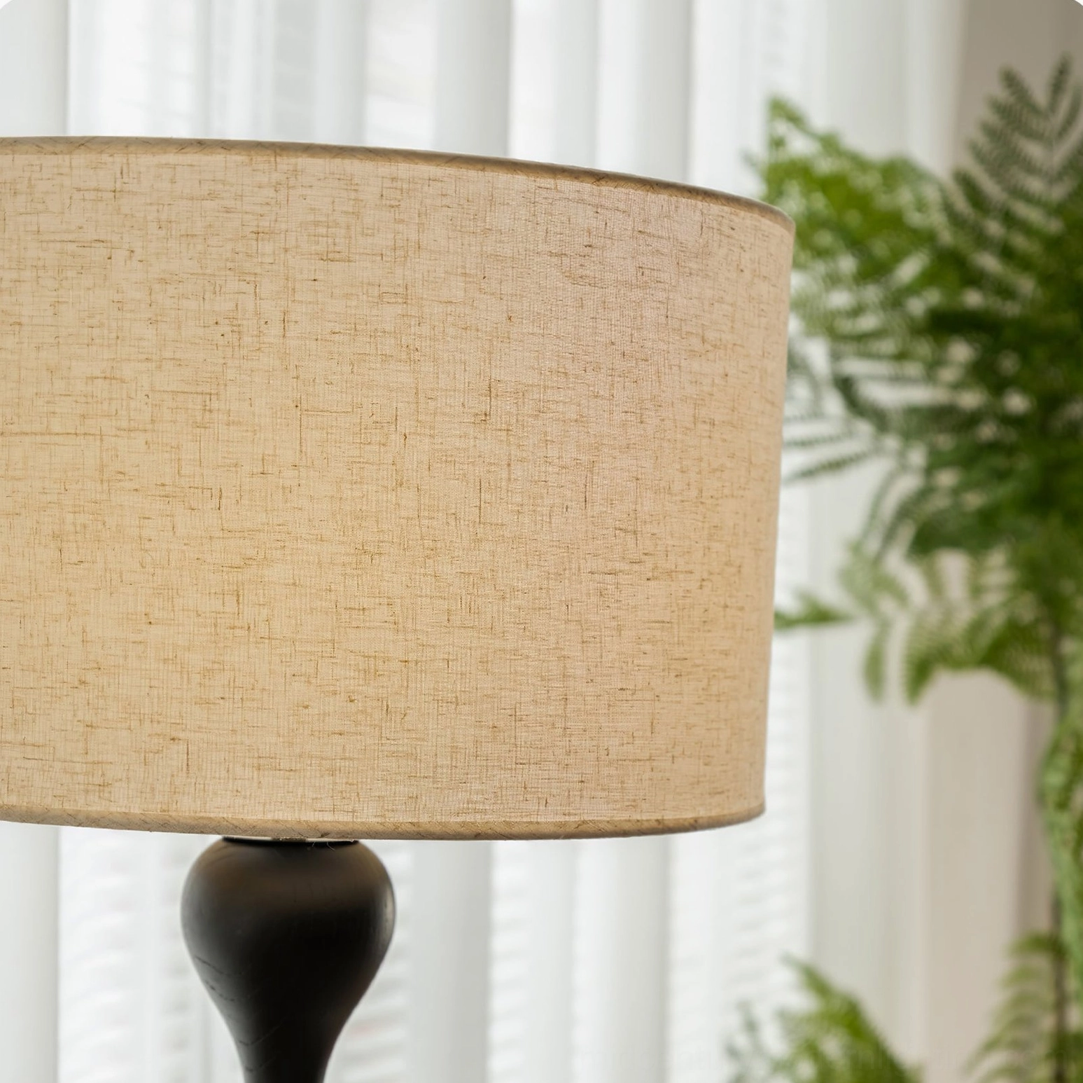 Norden mid-century floor lamp studio photography, sculptured wooden base and neutral fabric shade