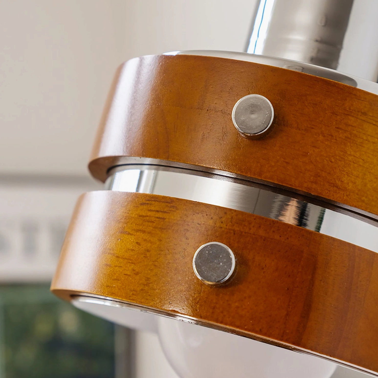 Nordic retro wall sconce with visible industrial rivet detail and warm lighting