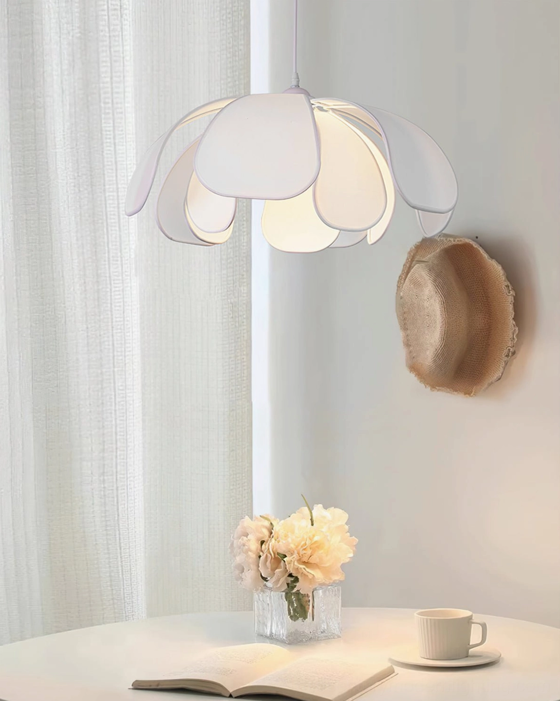 Norm white petal pendant lamp side three-quarter view bright dining nook sheer curtains